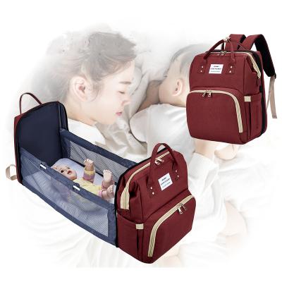 China 2021 New Multifunctional Water Resistant Travel Diaper Bag With Crib Baby Diaper Bags Foldable Bed Backpack for sale