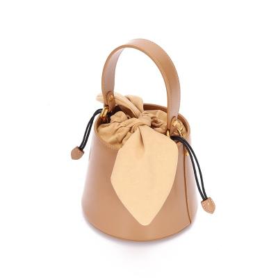 China 2021 Lady French Design Fashionable Ladies Shoulder Bag Bucket With Bow Knot Leather Women Handbags for sale