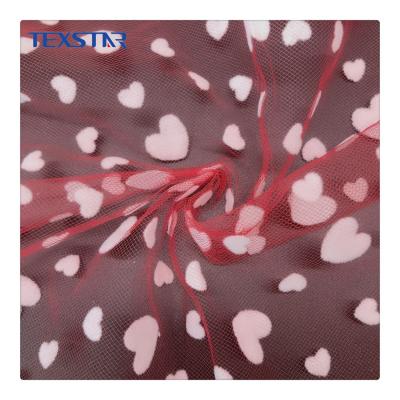 China Fashion Large Polyester 100% Red Flower Flocking Flocking Printed Tulle Fabric For Home Textile for sale