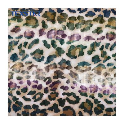 China Shiny stretch animal pattern printed with dot foil polyester spandex fabric for swimwear and clothes for sale