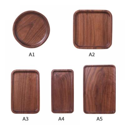 China Minimalist Round Wooden Wood Tray Cake Snack Plate Black Walnut Dessert Serving Tray Dishes Wood Utensils Tableware Gifts for sale