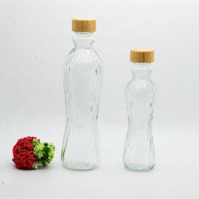 China Collection Sustainable Shape Size Glass Water Bottle With Bamboo Lid for sale