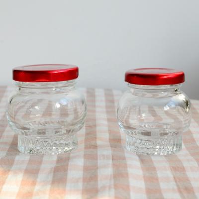 China Wholesale high quality freshness preservation round glass jar with metal lid for candy for sale