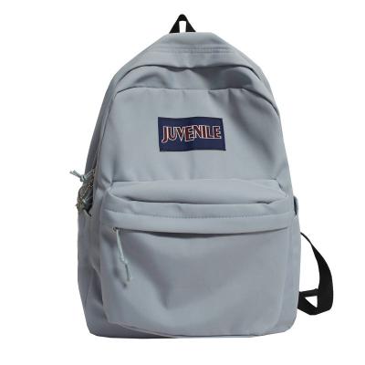 China 2021 waterproof new simple campus fashion solid color backpack schoolbag for boys and girls for sale