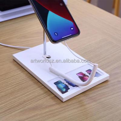 China wireless charging phone stand cell phone store phone stand with alarm for sale