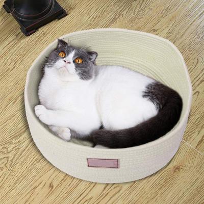 China Cute Cotton Pet Fun Room Viable Rope Woven Interlocking Rest Cat Bed Storage Baskets Nest Round Sleep Warm Medium Bed for sale