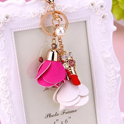 China Popular Luxury Pearl Crystal Metal Key Chains Rings Rose Flower Lipgloss Keychain Women Bag Charms Wholesale High Quality for sale