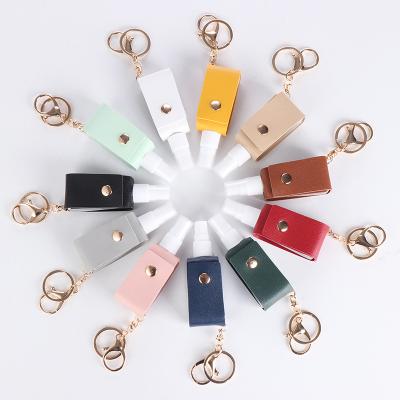 China Custom Leather Key Chain Holder Hand Sanitizer Hand Sanitizer Holder Wholesale Car Key Chains PU Car Key Chain Holder White With Tassel for sale