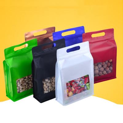 China Aluminum Foil Flat Bottom Pouch Window Kraft Paper Food Packaging Moisture Proof Plastic Bag With Handle Edible Mylar Bags for sale