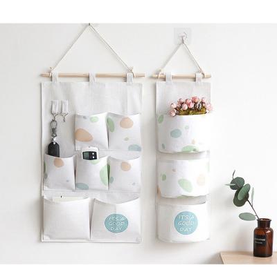 China Wholesale CLASSIC Japanese Korean Single Bedroom Cotton And Canvas Hanging Wall Mounted Storage And Storage Bag Objects Organizer Small for sale