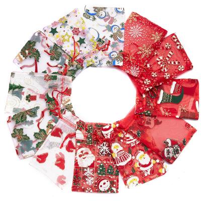 China Christmas Candy Bags 1pcs Random Style Christmas Pattern Apple Cookie Candy Gauze Drawstring Pocket Bag for sale