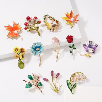 China Trendy Brooches For Women Rhinestone Pins Crystal Pearl Maple Leaf Tulip Oil Flower Bell Orchid Fashion Drip Brooch For Ladies for sale