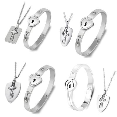 China TRENDY stainless steel necklace set women jewelry necklace and bracelet projection lovers bracelet couple lock necklaces bracelets sets for sale