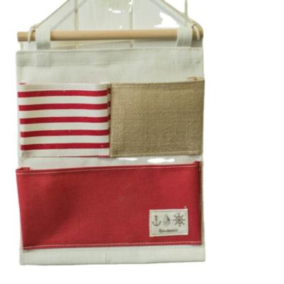 China Sustainable Hemp Wall Hanging Cotton Grid Storage Bag Multi Sundries Storage Bag for sale