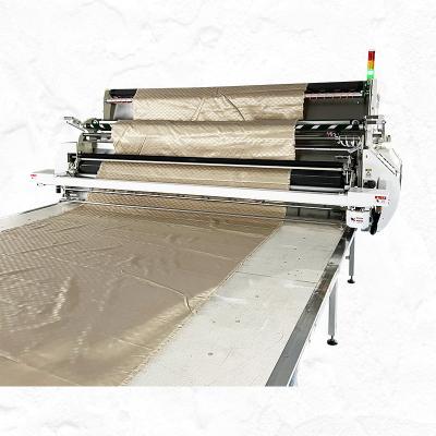 China Garment Shops Smart XIAOMAI Fabric Prerelax Textile Fabric Custom Fabric Spreading Machine for sale