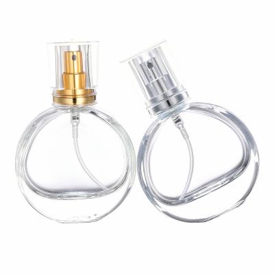 China High Qiality 25ml Portable Refillable Pole Flattened Glass Empty Perfume Bottle High Quality Flat Round Spray Bottle for sale