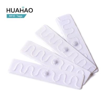 China Raincoat/Waterproof Free Sample! HUAHAO RFID Manufacturer RFID Tag For Clothing Laundry Washable Tags UHF Sticker Printable RFID Cloth Tag for sale