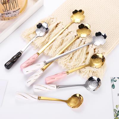 China Viable Gold Flower Stainless Steel Food Grade Coffee Dessert Spoon Mixing Scoop Cutlery With Ceramic Short Handle for sale