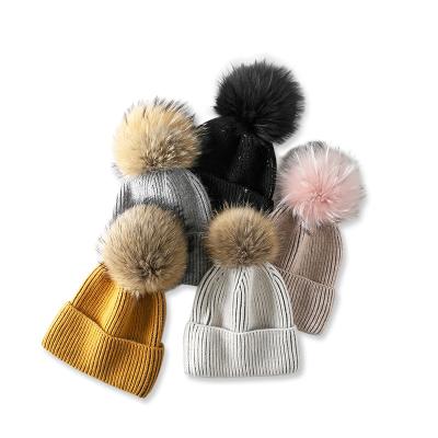 China BSC0090 COMMON Wholesale Winter Rabbit Hair Knit Beanies Women Fashion Striped Fur Pom Pom Hats for sale