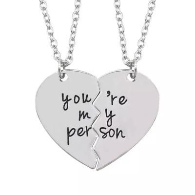 China Stainless Steel You Are My Person Custom Words Engraved Split Broken Heart Logo Necklace Couples Pendant Necklace for sale