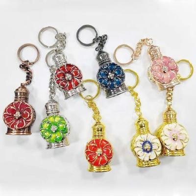 China Personal Care Stock 3ml Arabian Metal Alloy Perfume Key Ring Chain Flower Shell Mini Pocket Glass Essential Oil Refillable To Bottle#887 for sale