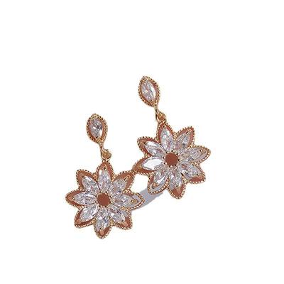 China TRENDY Temperament Cavity Crystal Flower Earrings Gold Plated Zircon Petal Stud Earrings For Women Girls for sale