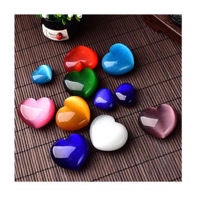 China Wholesale Natural Stone From Europe Crystal Carving Heart Shaped Rocks Cat Eye For Gift for sale