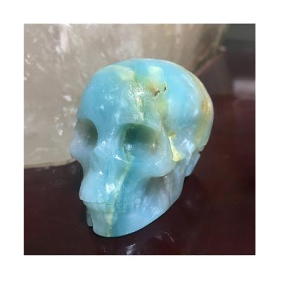 China Europe Newcomers Hand Carved Folk Crafts Natural Caribbean Sky Blue Calcite Skulls For Healing for sale