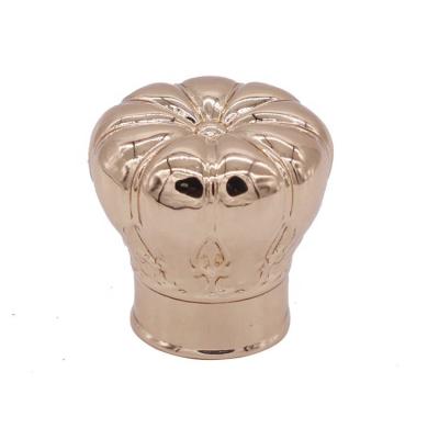 China Non Spill Custom Cosmetic Over The Cap Bottle Lid Crown Gold Perfume Cap With Engrave Logo for sale