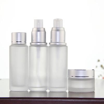 China 50ml 80ml Gold Skin Care Cosmetic Creams Silver Airtight Glass Cosmetic Bottle Custom Packaging Set Bottles 80ml Glass Bottle For Cream for sale