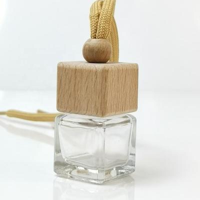 China Eco-friendly Recyclable Custom Empty Diffuser 10ml Duct Air Hanging Cap Wooden Car Perfume Bottle for sale