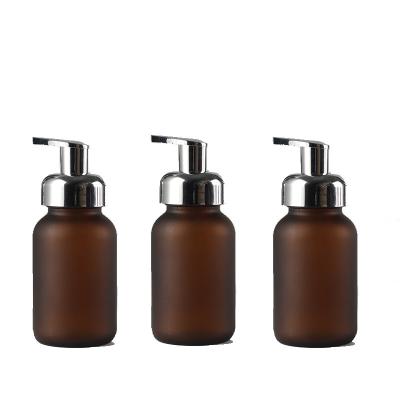 China Personal Care Amber Glass Foaming Soap Bottle Empty With Pump Plastic for sale