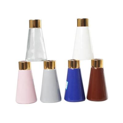 China Garment 30ml 50ml Frosted Cone Shape Aromatherapy Bottle Glass With Plated Plastic Lid for sale