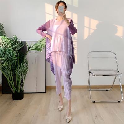 China FXZ QUICK DRY miyake pleated suit women 2022 summer new design irregular top gradient springs wide leg pants pleats two pieces set for sale