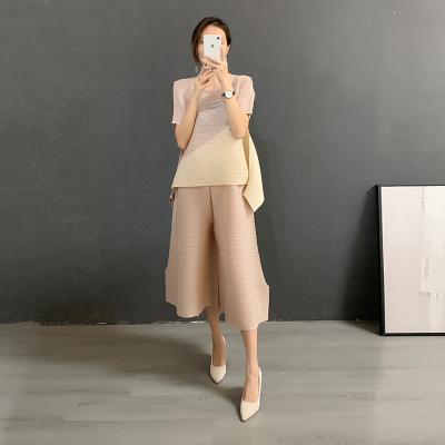 China 2022 new design miyake pleated short sleeve matching two piece set QUICK DRY color loose plus size suit pleats for sale