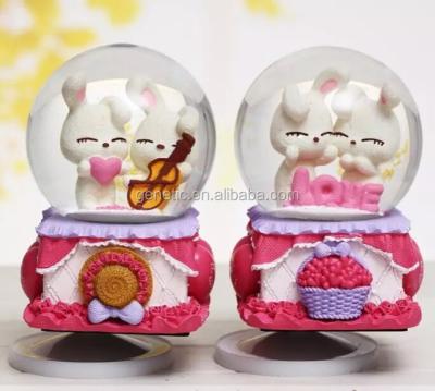 China Asia Wholesale Rotate Snow Globe With Music Love Theme For Gift for sale