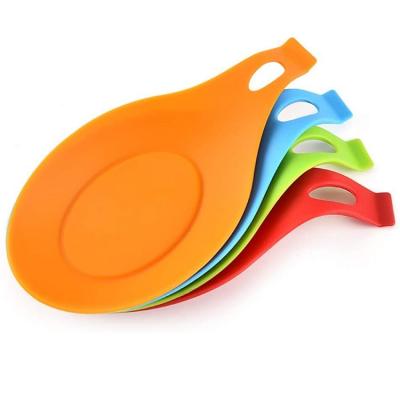 China Viable Flexible Silicone Kitchen Utensil Rest Pocket Spoon Holder Almond Shaped Silicone Spoon Rest for sale