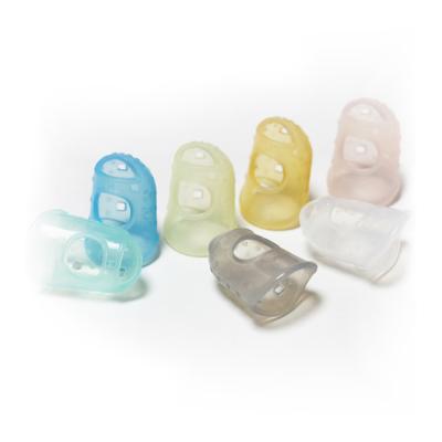 China Work Pad Size Quality Colored Silicone Gummed Finger Cradles For Protect Finger for sale