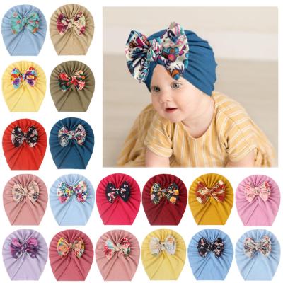 China New European and American style baby bow hat children soft and comfortable warm bow hat turban printing hat for sale