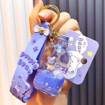 China SILEYN Bag Bear Keychains Soda Bottle Liquid Top Selling Personalized Purple Key Chain Floating Key Chain for sale