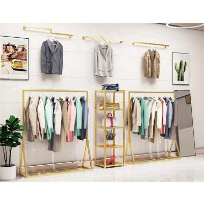 China Modern Elegant Custom Made Wedding Dress Shop Rose Gold Storage Rack Clothing Display Racks and Racks Display Furniture Decoration for sale