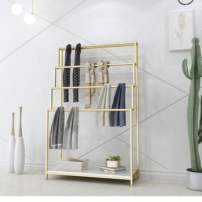 China Modern Stylish Hot Sale Portable Retail Display Rack Garments Display Stand Custom Design Gold Clothing Rack For Store for sale