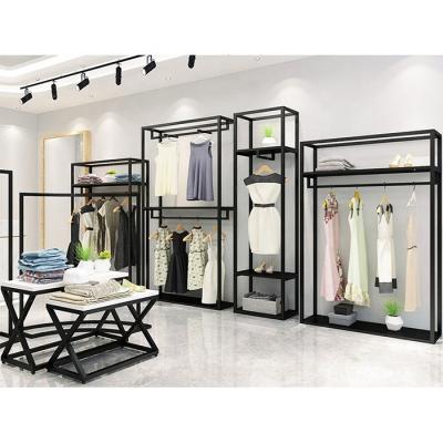 China Modern Stylish Retail Hanging Clothes Racks Storage Racks Gold Clothing Stainless Steel Wall Display Racks For Clothes Shop Bridal Store for sale