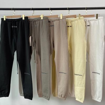 China 2022 Anti-Wrinkle Newcomers Letter Loose Elastic Waist Sweatpants Fashion Solid Color Casual 100% Cotton Plus Size Pants Men for sale