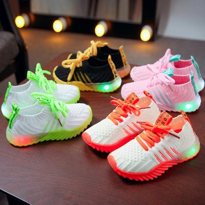 China Net red battery LED lights knitted children's shoes 2021 spring and new autumn shoes boys and girls luminous shoes for sale