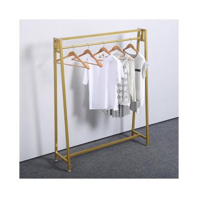 China Gold Industrial Rustic Retail Clothing Metal Wooden Rustic Racks For Clothing Store Women for sale