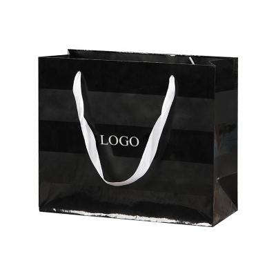 China Recycled Materials Custom Logo Printed Paper Shopping Bag Gift Packaging Black Paper Bag for sale