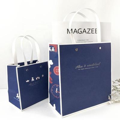 China Hot Recycled Materials Products Art Paper Custom Logo Printed Gift Bags Kraft Paper Bag Paper Shopping Bag for sale