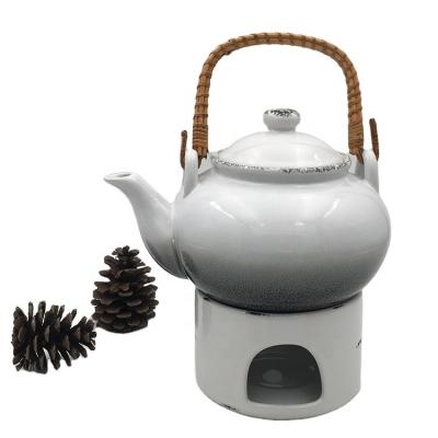 China Sustainable Handmade Custom Design White Ceramic Teapot With Warmer for sale