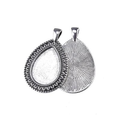 China DIY Jewelry Accessory Drop Cabochon Base (Earring Pendant or Keychains) Setting Flower Tray Die Cut Alloy Pendant Jewelry Masks DIY Key Chain Accessories for sale